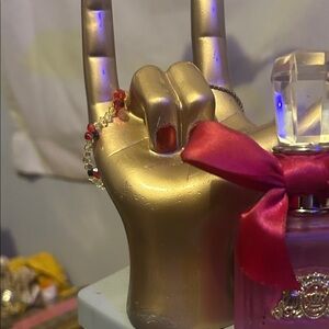 Gold Hand Jewelry Holder with Red Accents